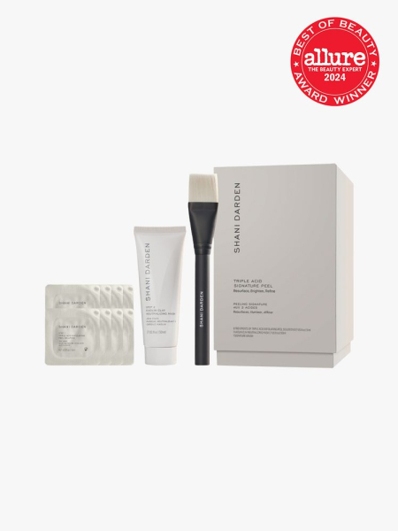 facial peel system with brush applicator product and additional sachets next to branded box packaging on light gray background&nbsp;with red and white 2024 allure best of beauty seal